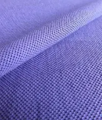 A close up image of a blue colour pique knit fabric roll