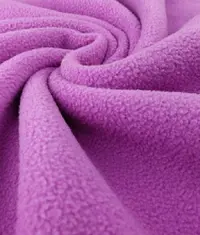 A close up image of a grey colour fleece knit fabric roll