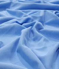A close up image of a royal blue colour suvin knit fabric