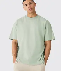 A man wearing a trendy oversized t shirt in light grey colour