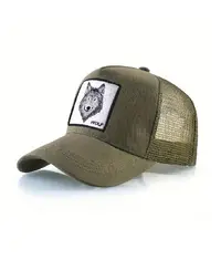 A man wearing a trucker hat in the wild outdoors